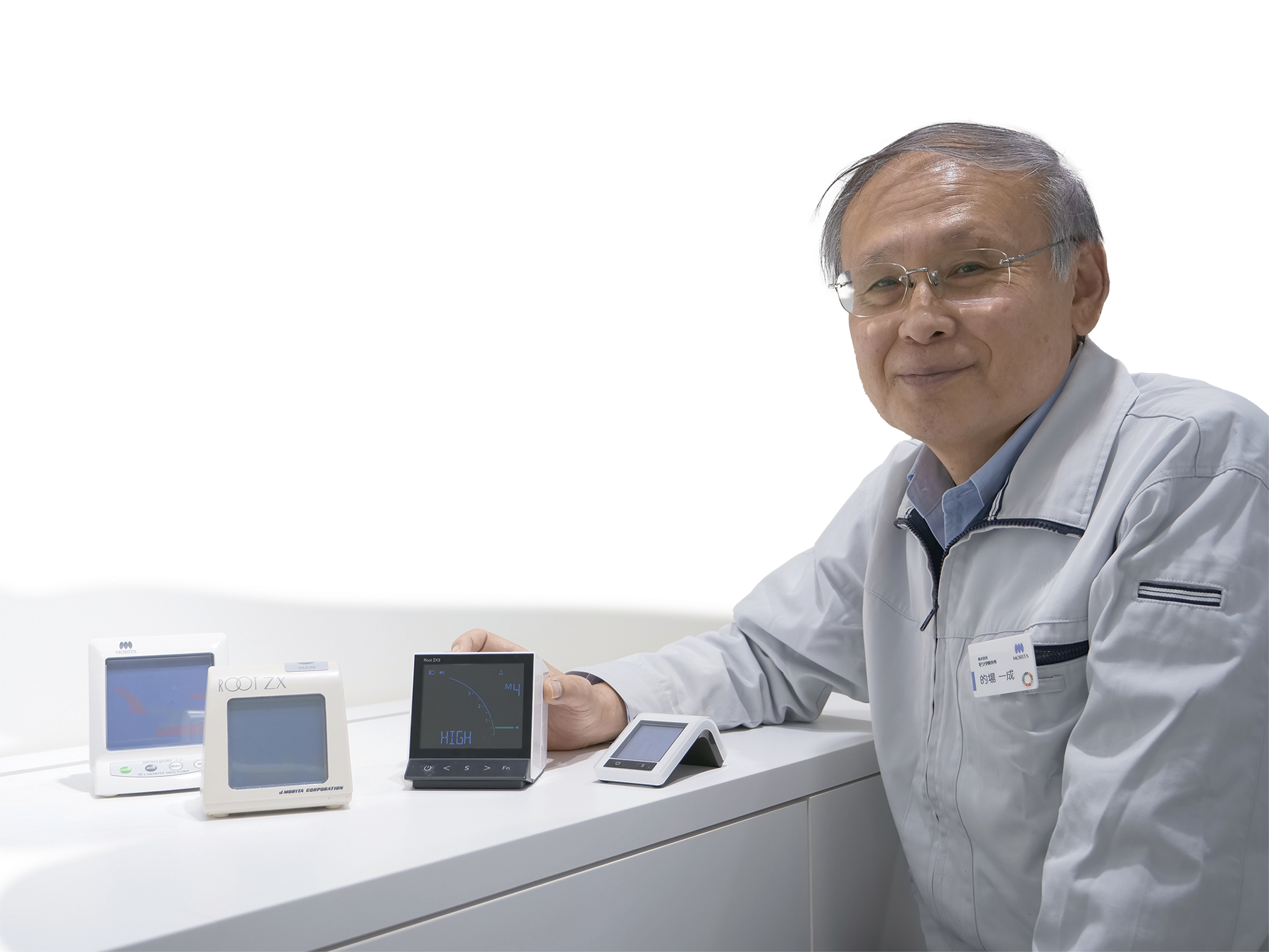 Kazunari Matoba Former General Manager of Research and Development, J MORITA MFG CORP – Pictured with (from left to right) Root ZX II, Root ZX, Root ZX3, Root ZX mini | Image Credit: © J MORITA MFG CORP